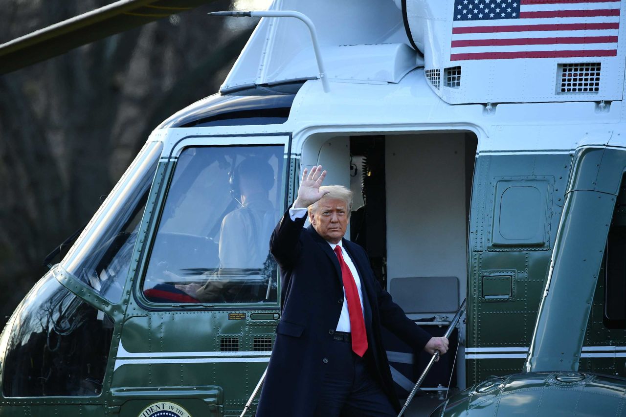 US President Donald Trump waves as he boards Marine One for the final time on Wednesday, January 20. Trump, <a href="https://www.cnn.com/2021/01/19/politics/trump-leaving-white-house-farewell-address/index.html" target="_blank">still bitter about the election,</a> skipped Joe Biden's inauguration and many of the <a href="https://www.cnn.com/interactive/2021/01/politics/inauguration-photography-cnnphotos/" target="_blank">time-honored traditions</a> that come with the peaceful transfer of power. It was the first time in 150 years that the outgoing president had boycotted his successor's inauguration.