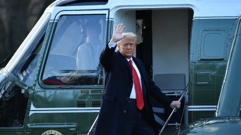 Trump waves as he boards Marine One at the White House.