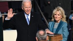 TOPSHOT - Joe Biden (L), flanked by incoming US First Lady Jill Biden is sworn in as the 46th US President by Supreme Court Chief Justice John Roberts on January 20, 2021, at the US Capitol in Washington, DC. (Photo by SAUL LOEB / POOL / AFP) (Photo by SAUL LOEB/POOL/AFP via Getty Images)