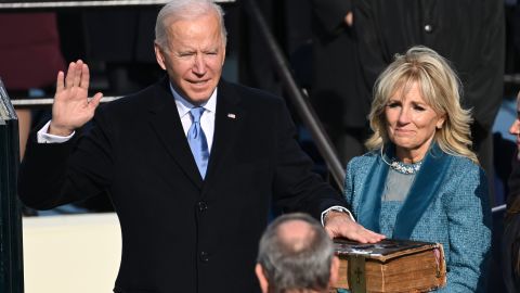 Joe Biden, flanked by incoming First Lady Jill Biden, is sworn in as the 46th US President on January 20, 2021, at the US Capitol in Washington, DC. (Photo by Saul Loeb via Getty Images)
