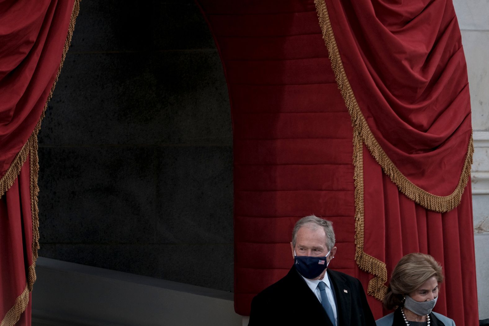 Former President Bush and first lady Laura Bush arrive at the inauguration.