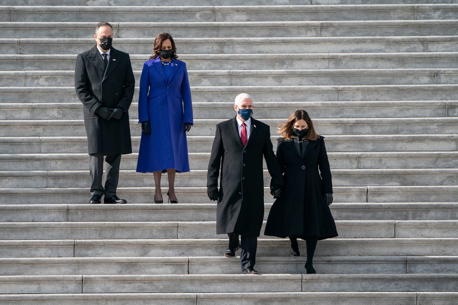 Harris and her husband, Doug Emhoff, follow former Vice President Mike Pence and second lady Karen Pence after the inauguration.