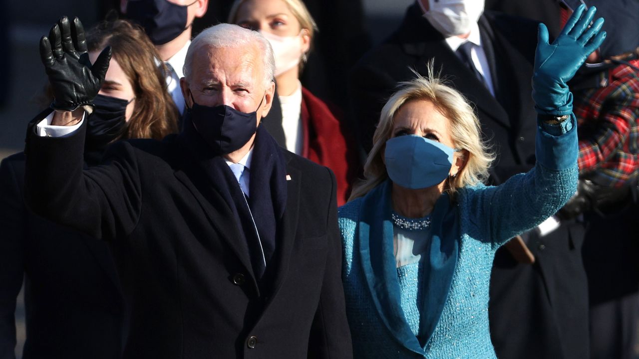 WASHINGTON, DC - JANUARY 20:  U.S. President Joe Biden and First Lady Dr. Jill Biden walk the abbreviated parade route after Biden's inauguration on January 20, 2021 in Washington, DC.  Biden became the 46th president of the United States earlier today during the ceremony at the U.S. Capitol.  (Photo by Patrick Smith/Getty Images)