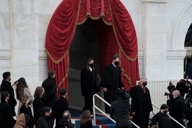 Supreme Court justices arrive for the swearing-in ceremony. Justices Samuel Alito, Clarence Thomas and Stephen Breyer <a href="index.php?page=&url=https%3A%2F%2Fwww.cnn.com%2Fpolitics%2Flive-news%2Fbiden-harris-inauguration-day-2021%2Fh_c98047ce89b9376569ce57481aea1100" target="_blank">did not attend the inauguration</a> because of the health risks posed by the pandemic. Alito, Thomas and Breyer are also the oldest members of the court.