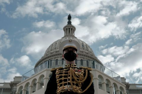 The Marine Band conductor is seen in front of the Capitol during the inauguration.