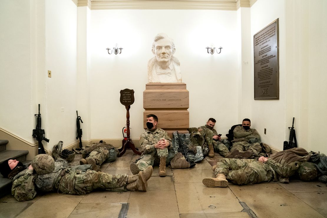Members of the National Guard rest in the U.S. Capitol.  