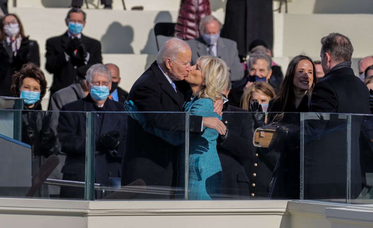 The Bidens kiss at the inauguration ceremony.