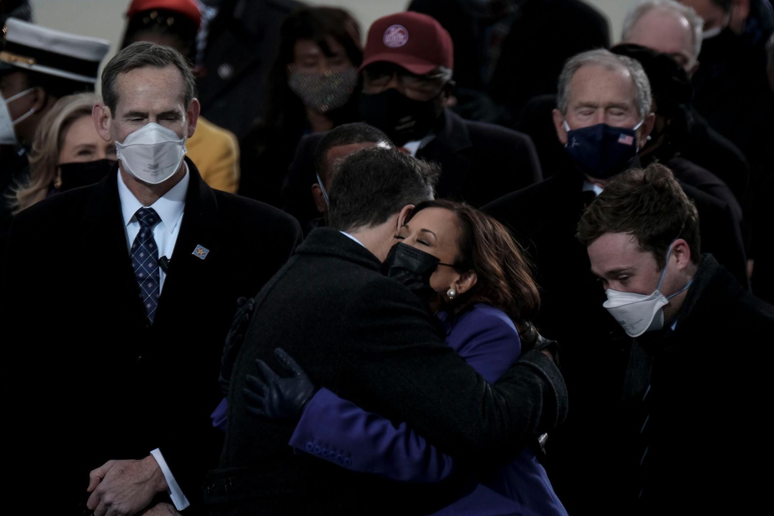 Harris hugs her husband before being sworn in as vice president.