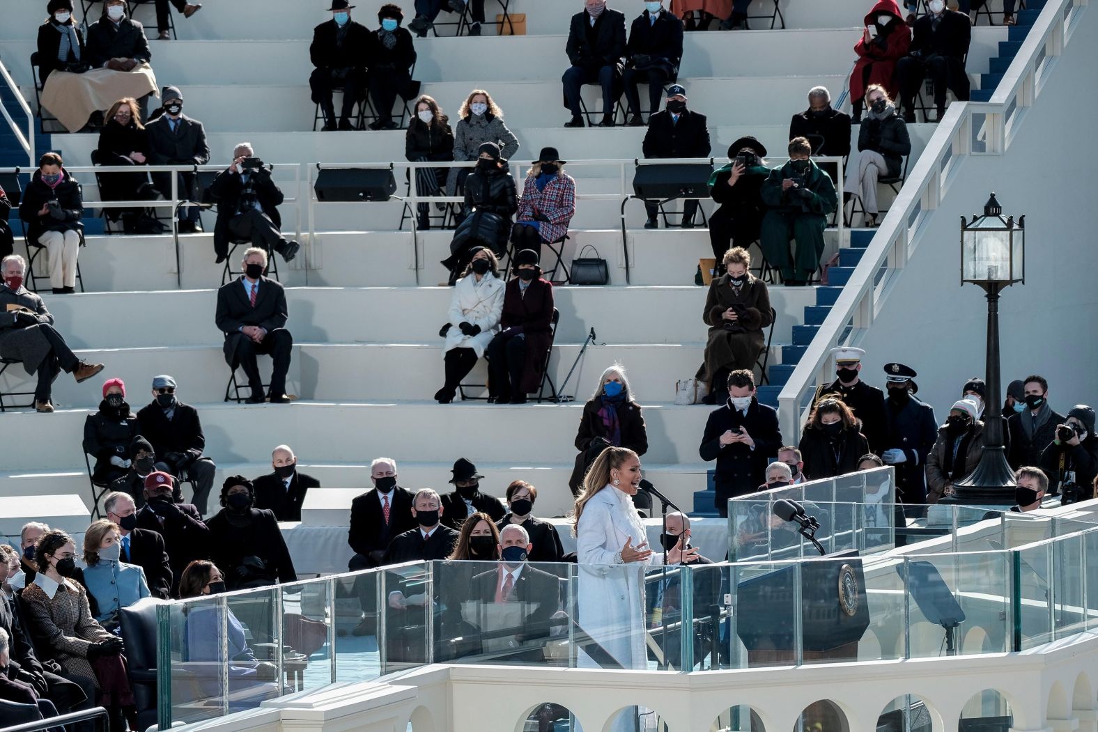 Jennifer Lopez <a href="https://www.cnn.com/politics/live-news/biden-harris-inauguration-day-2021/h_55aa13d6beb945fb80524ae366fc8608" target="_blank">sings during the ceremony.</a> She performed "America the Beautiful" and "This Land Is Your Land."