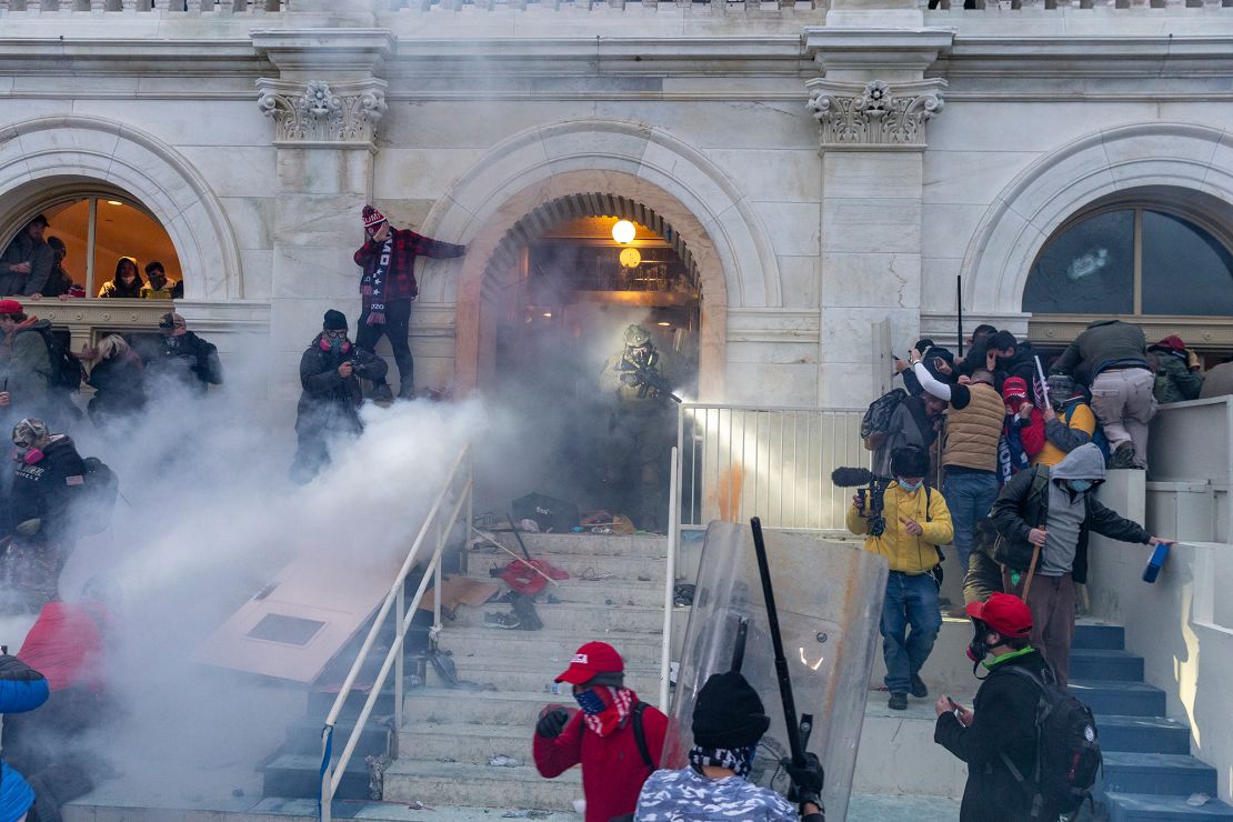 Police use tear gas as pro-Trump supporters riot and breach the building. 