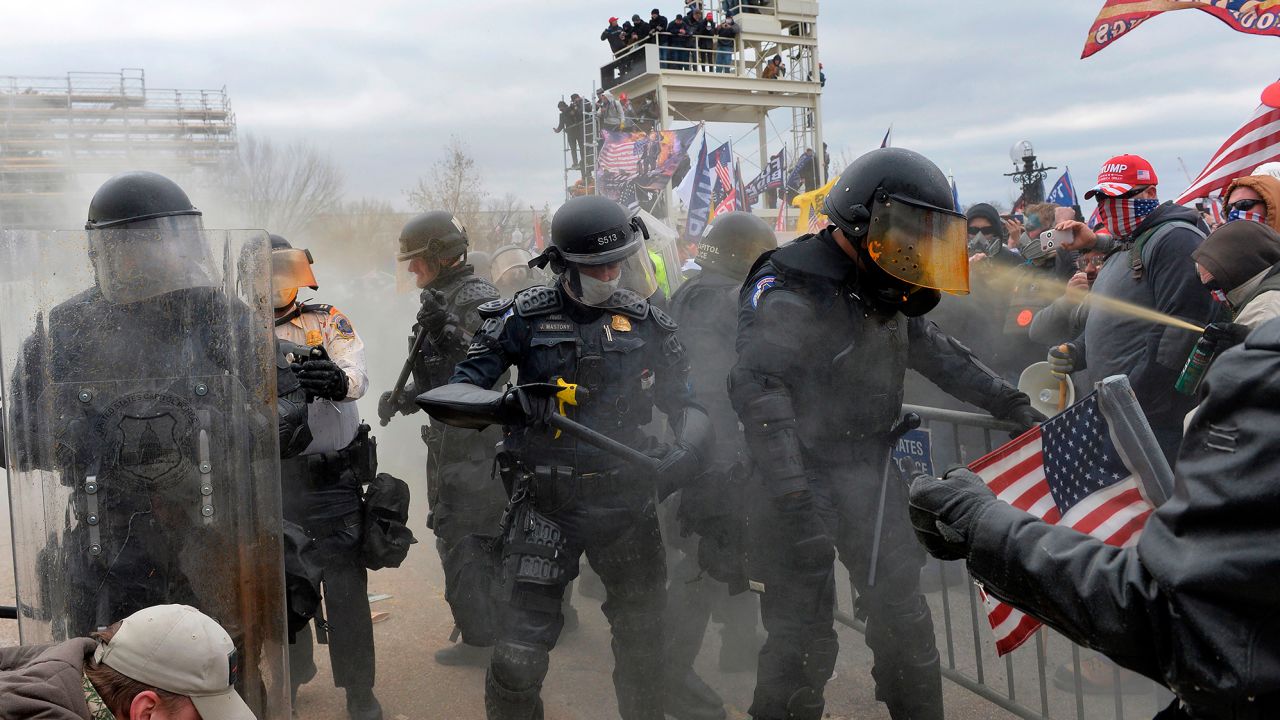 Trump supporters clash with police and security forces as they try to storm the US Capitol in Washington, DC on January 6, 2021