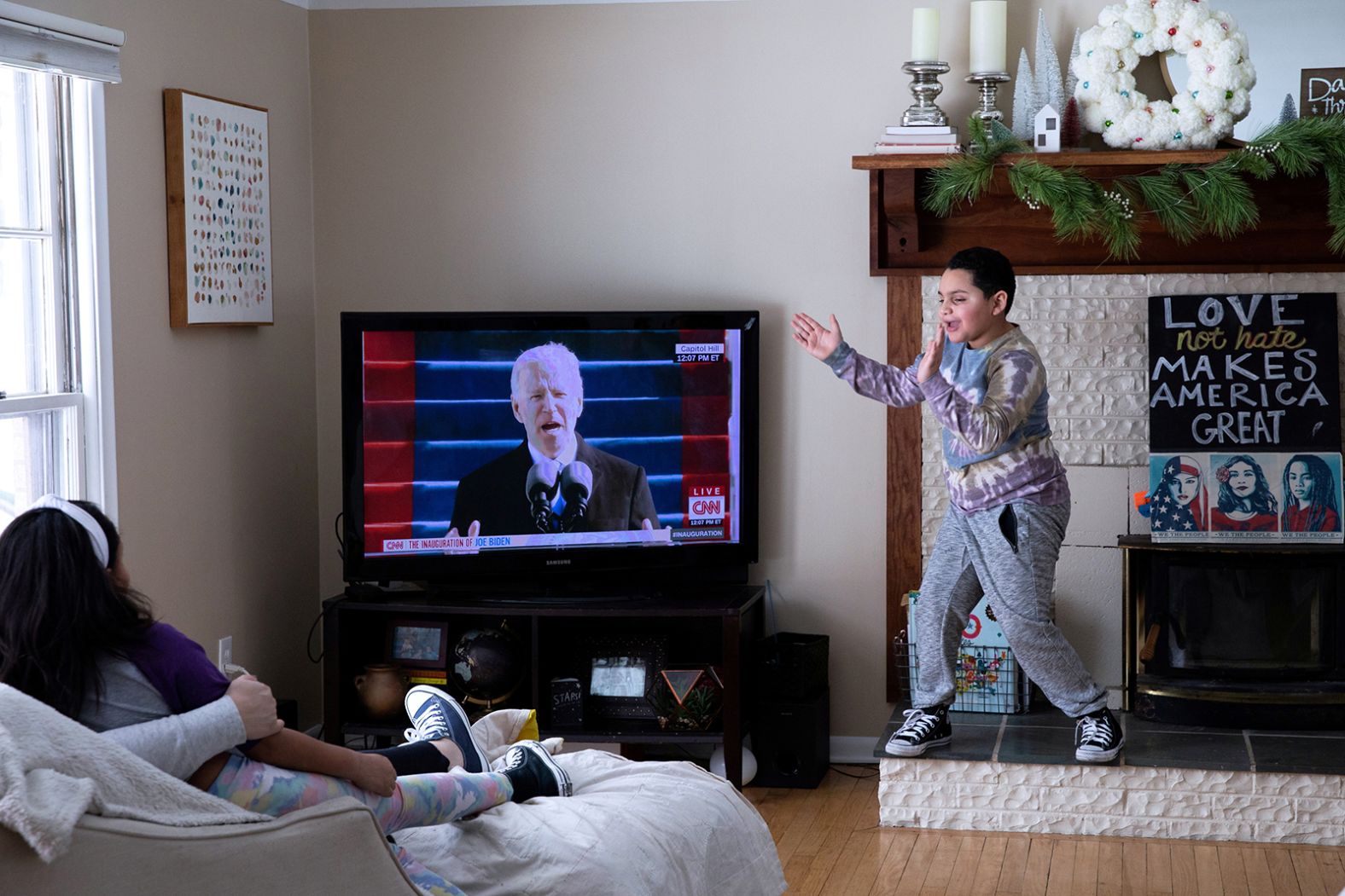 Jackson Smith cheers as he watches the inauguration with his family at their home in Beverly Hills, Michigan.