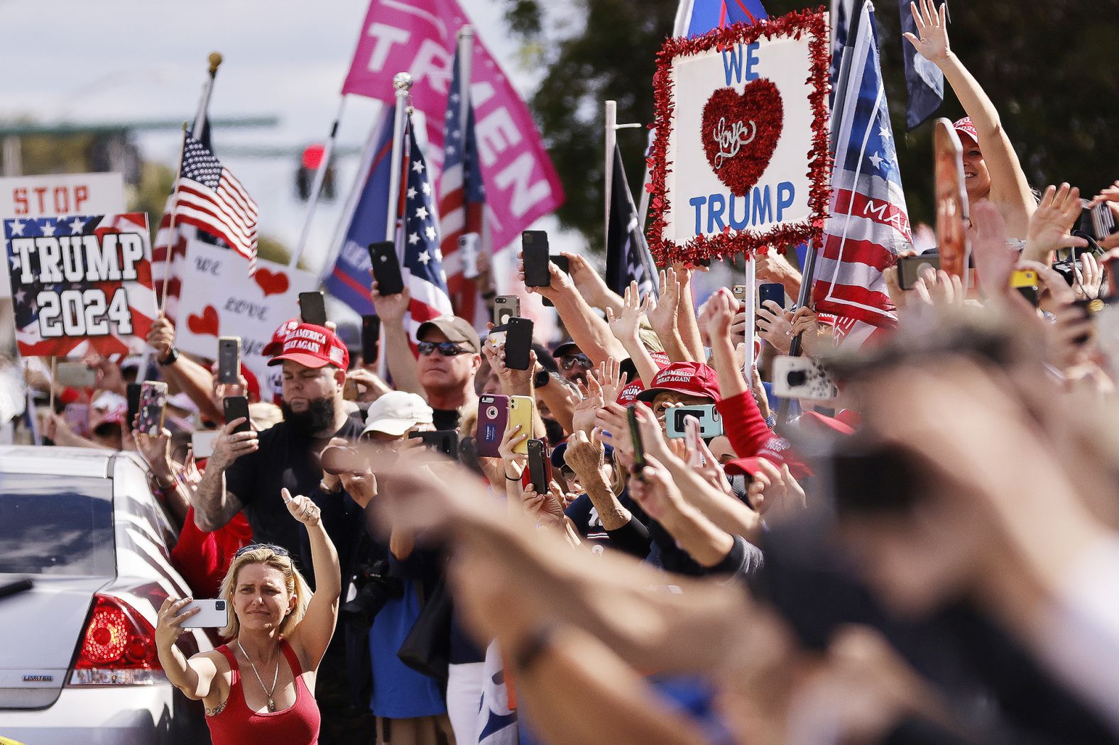 Trump supporters wave to Trump as he returns to his Mar-a-Lago estate in Florida.