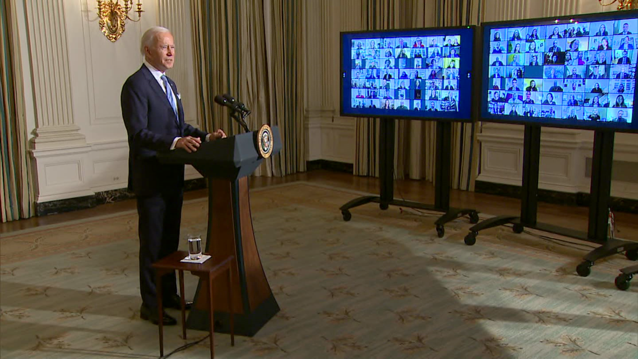 President Joe Biden addresses staff virtually on his first day in the White House. 