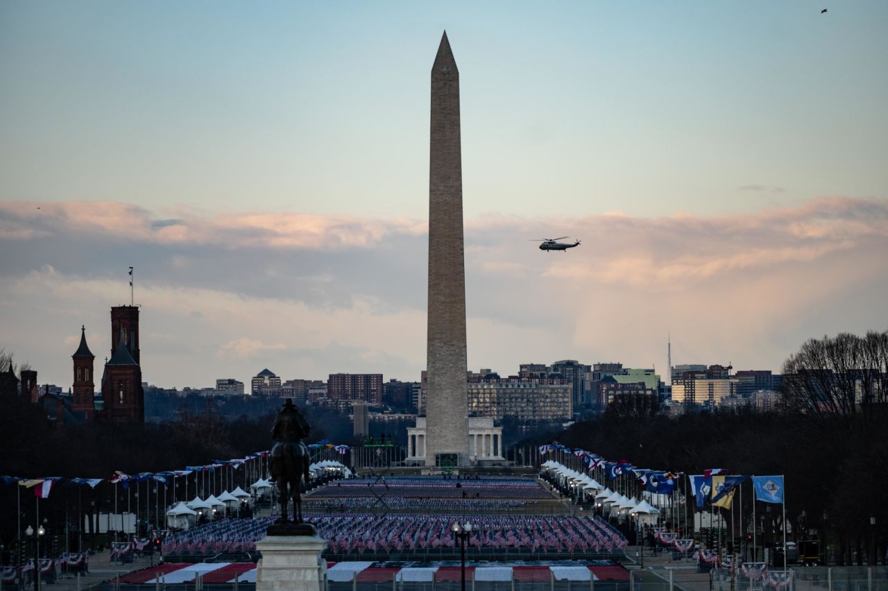 Marine One flies past the Washington Monument as President Donald Trump leaves the US capital early on Wednesday, January 20.
