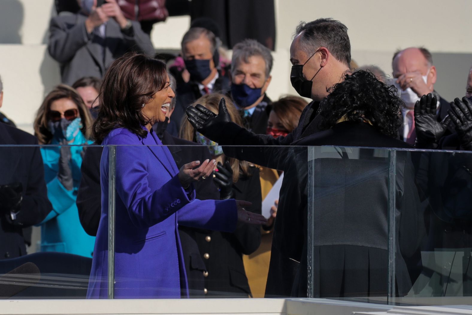 Harris smiles at her husband during her swearing-in.