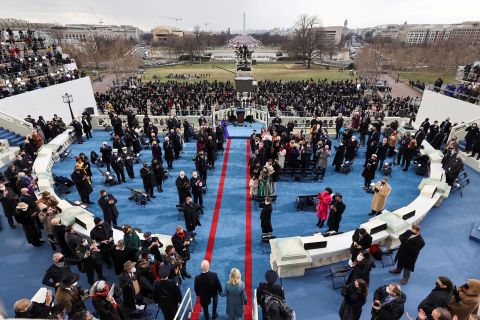 The Bidens walk out on stage for the inauguration.