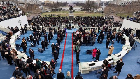 The Bidens walk out on stage for the inauguration.