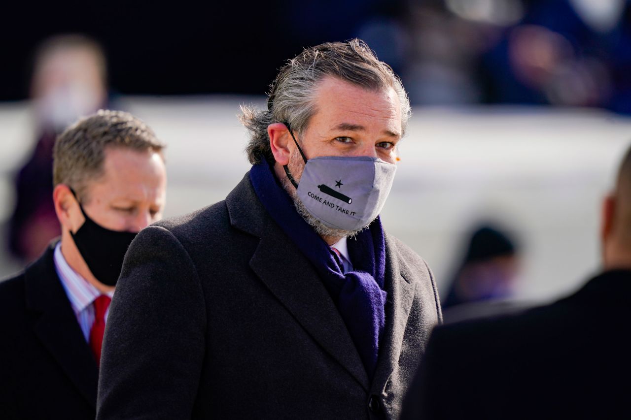 US Sen. Ted Cruz, a Republican from Texas, wears a face mask that reads "Come and Take It" as he arrives at the inauguration.
