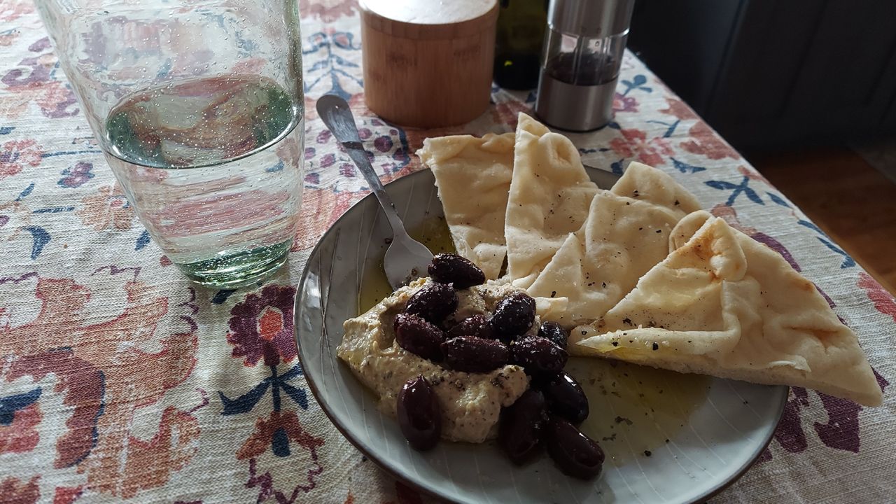 Althea Mullarkey's dinner routine includes lemon-dill hummus, olives and toasted naan with spicy oil.