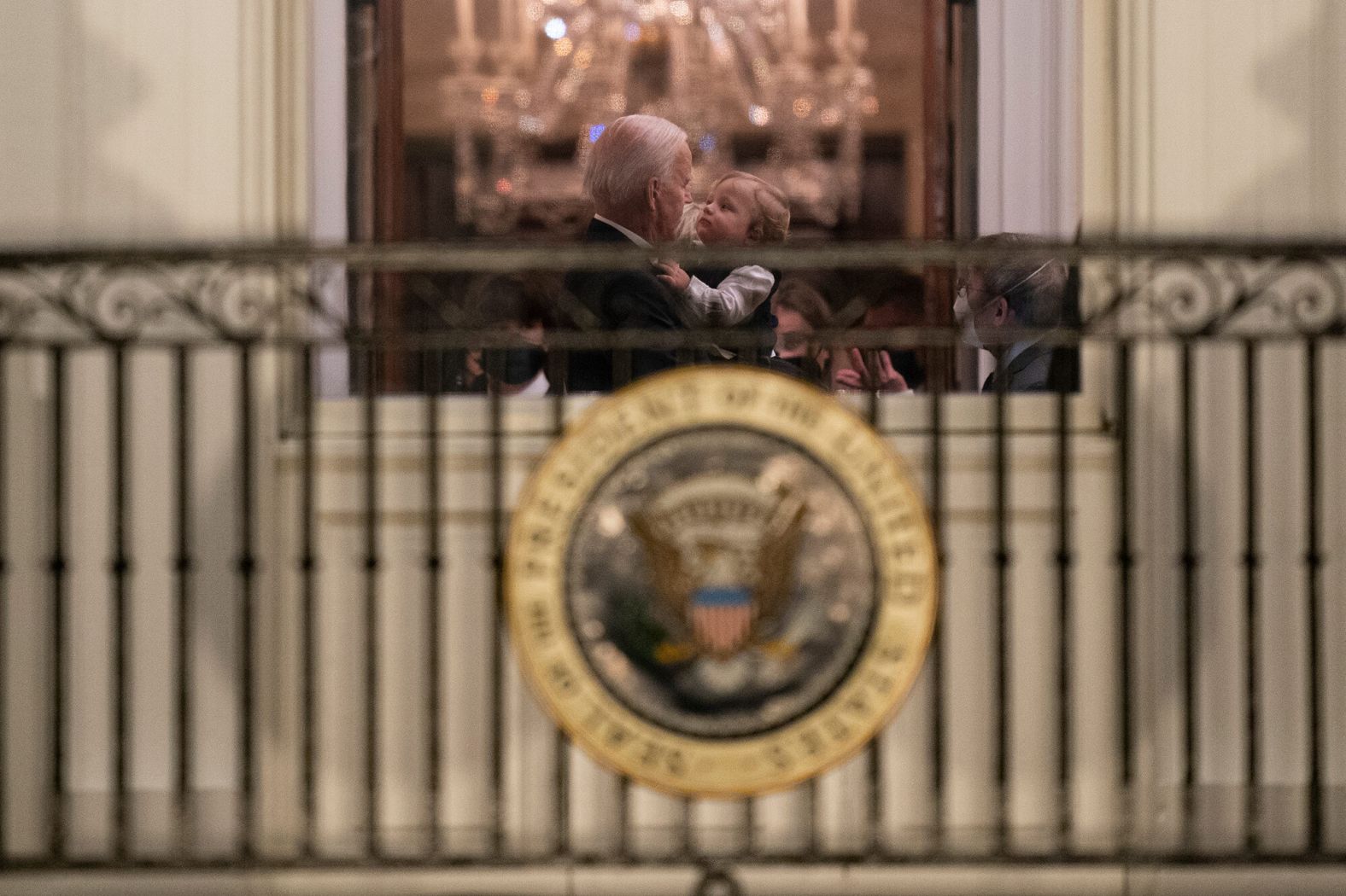 Biden holds his grandson Beau inside the White House.