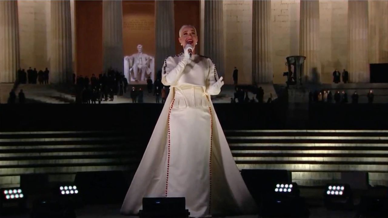 Katy Perry performs at the "Celebrating America" primetime special in an outfit by Thom Browne and heart-shaped earrings by Rahaminov Diamonds.