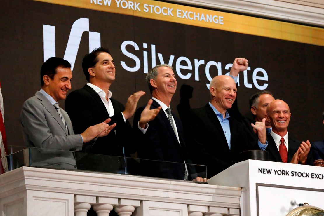 Slivergate CEO Alan Lane, second from right, is applauded as he rings the New York Stock Exchange opening bell before his bank's IPO begins trading, Thursday, Nov. 7, 2019. (AP Photo/Richard Drew)