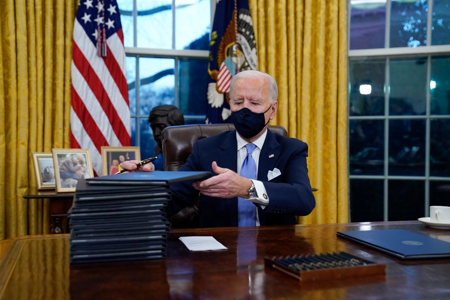 Biden <a href="https://www.cnn.com/2021/01/20/politics/executive-actions-biden/index.html" target="_blank">signs executive orders</a> in the Oval Office after his inauguration. "There's no time to start like today," Biden told reporters as he began signing a stack of orders and memoranda. "I'm going to start by keeping the promises I made to the American people."