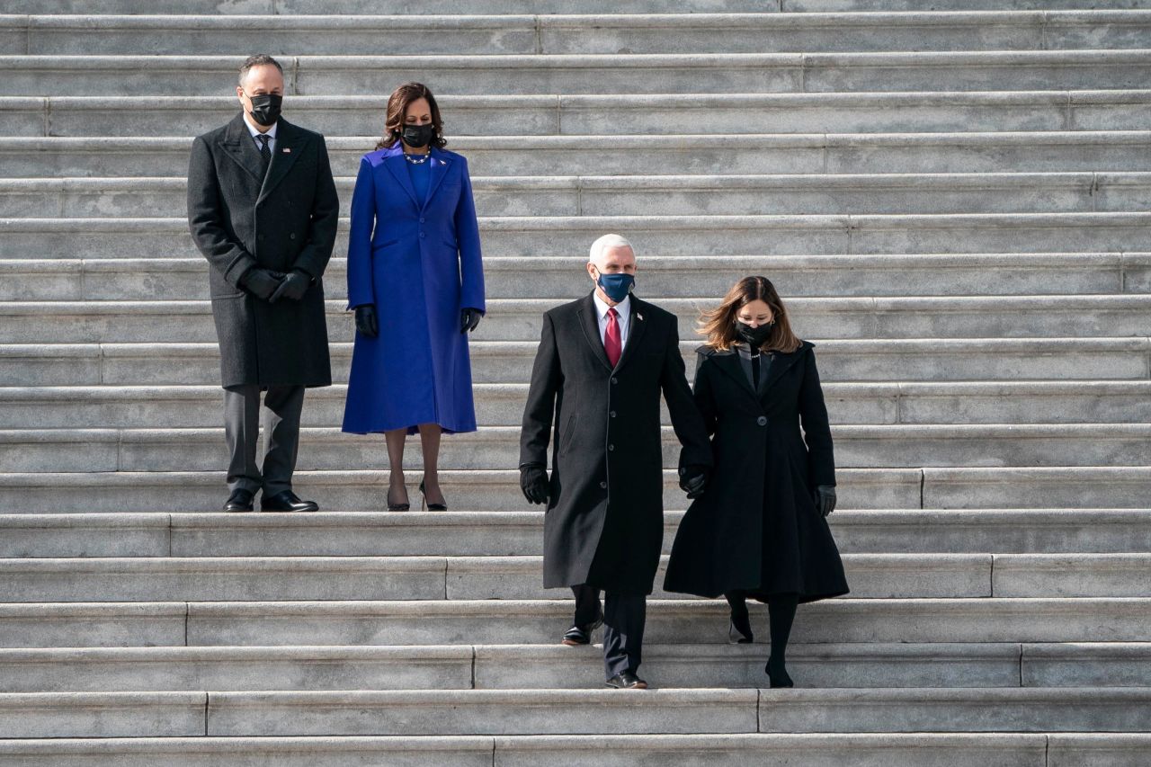 US Vice President Kamala Harris and her husband, Doug Emhoff, follow former Vice President Mike Pence and second lady Karen Pence after the inauguration on Wednesday, January 20.