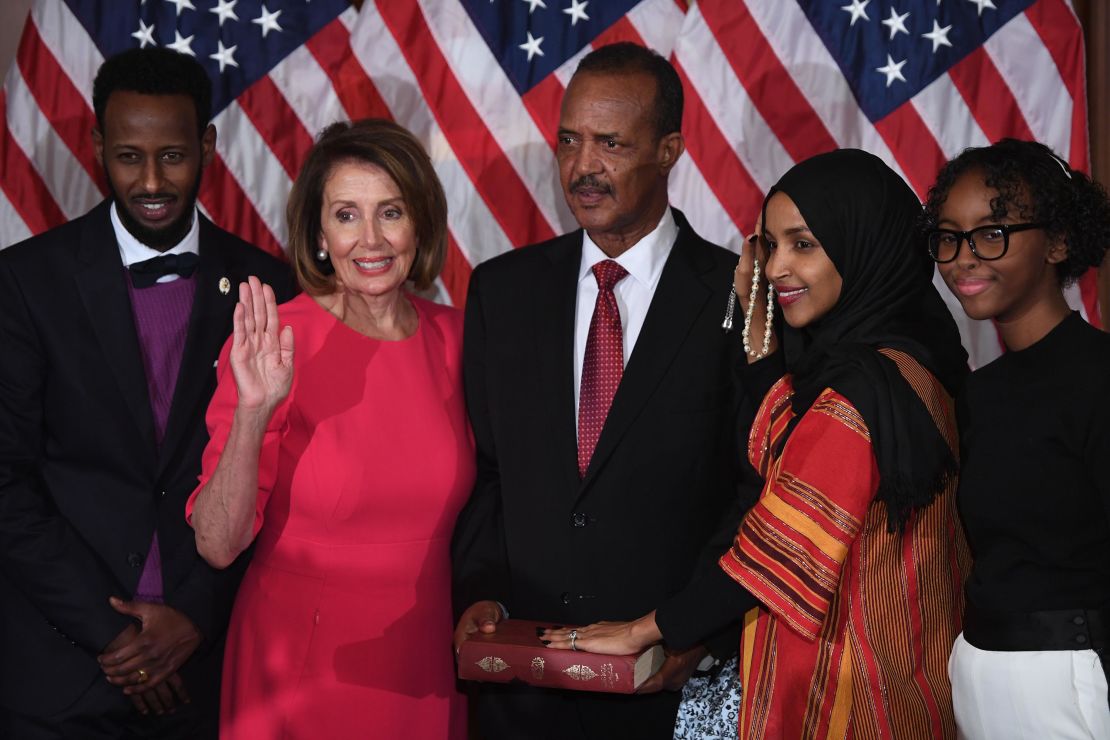 Rep. Ilhan Omar, with her hand on the Quran, is sworn in  during the start of the 116th Congress in 2019. 