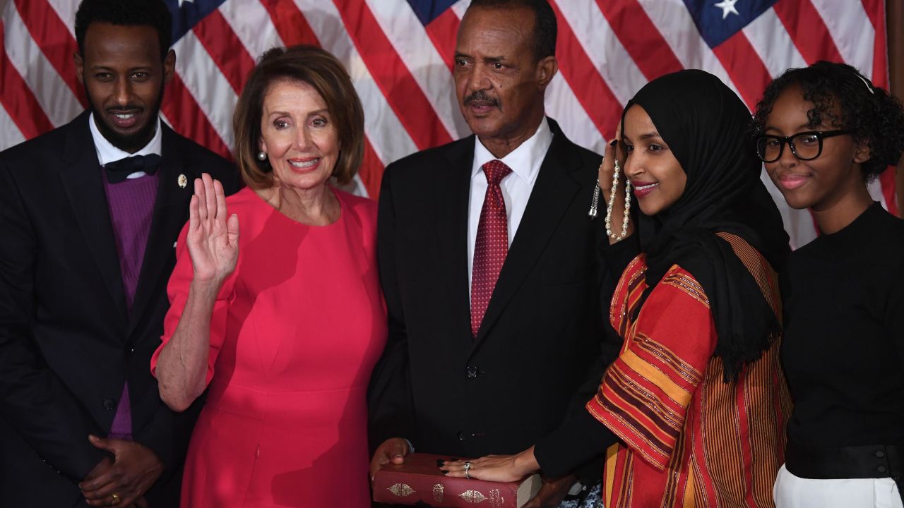 Rep. Ilhan Omar, with her hand on the Quran, is sworn in  during the start of the 116th Congress in 2019. 
