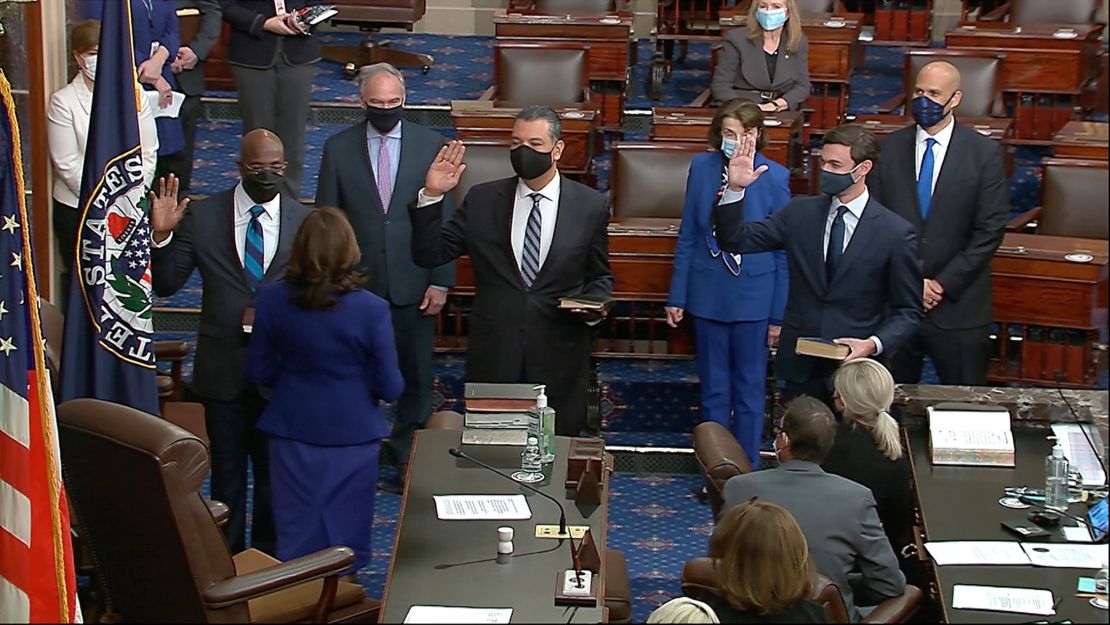 Vice President Kamala Harris swears in Sens. Raphael Warnock, Alex Padilla and Jon Ossoff on the floor of the Senate Wednesday.