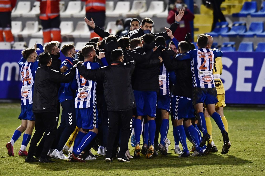 Alcoyano players celebrate after knocking out Real Madrid.