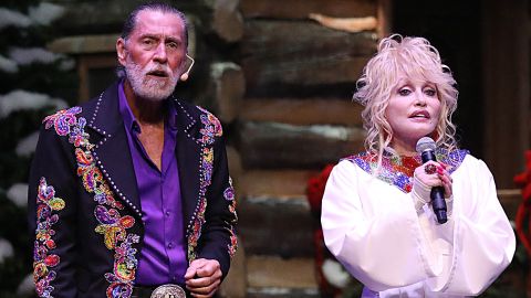 Randy Parton performs with his sister, megastar Dolly Parton, in a 2018 concert.