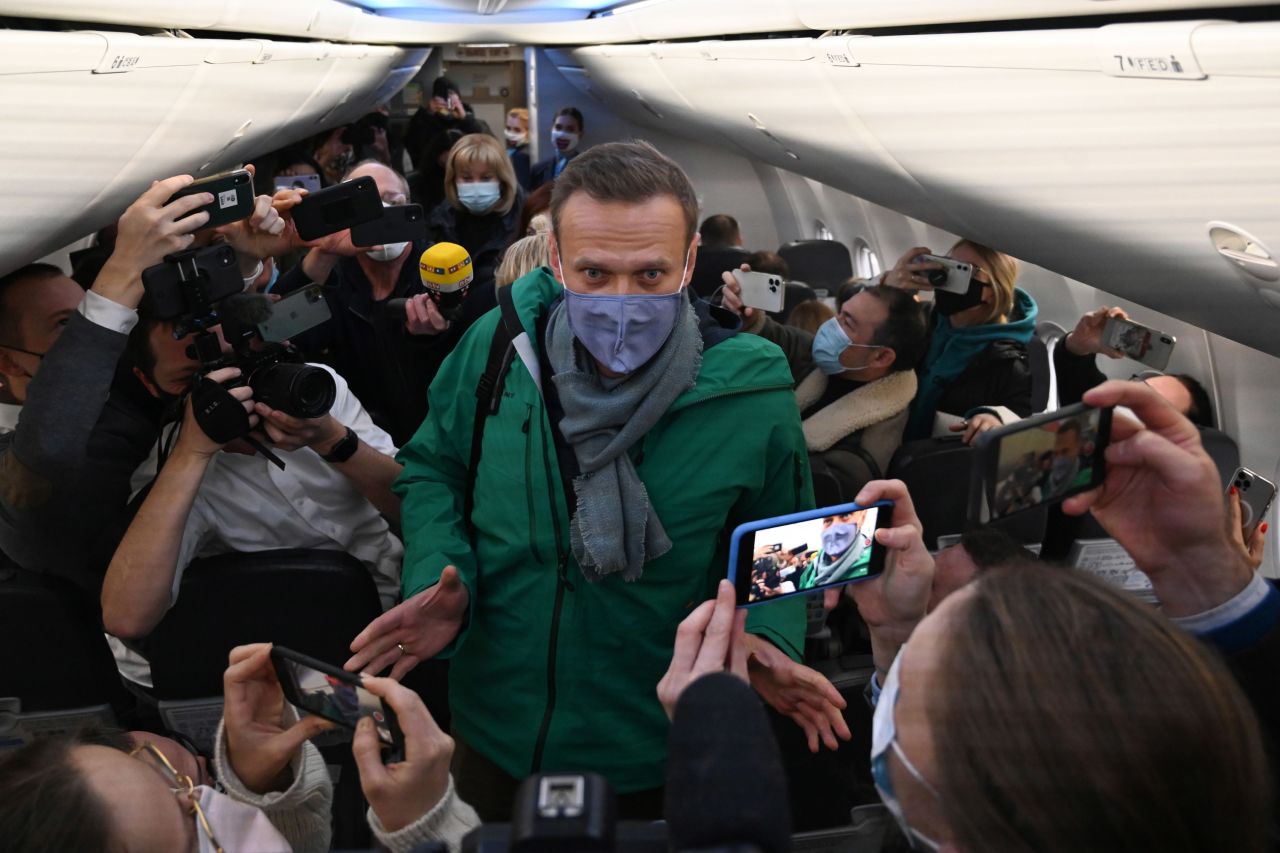 Russian opposition leader Alexei Navalny takes his seat on a Moscow-bound plane before taking off from Berlin on Sunday, January 17. <a href="https://www.cnn.com/2021/01/17/europe/alexey-navalny-return-russia-germany-grm-intl/index.html" target="_blank">Navalny was detained by police</a> moments after landing in Russia and five months after he was poisoned with the nerve agent Novichok. Navalny was placed on the country's federal wanted list last month for violating terms of probation related to a years-old fraud case, which he dismisses as politically motivated.