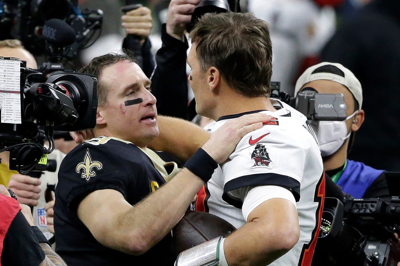 New Orleans quarterback Drew Brees, left, congratulates Tampa Bay quarterback Tom Brady after Brady's Buccaneers defeated Brees' Saints in an NFL playoff game on Sunday, January 17. It was the first playoff game in NFL history <a href="https://www.cnn.com/2021/01/15/sport/tom-brady-drew-brees-tampa-bay-buccaneers-new-orleans-saints-nfl-spt-intl/index.html" target="_blank">to feature two starting quarterbacks in their 40s.</a> Both players occupy the top two spots for nearly all quarterback records.