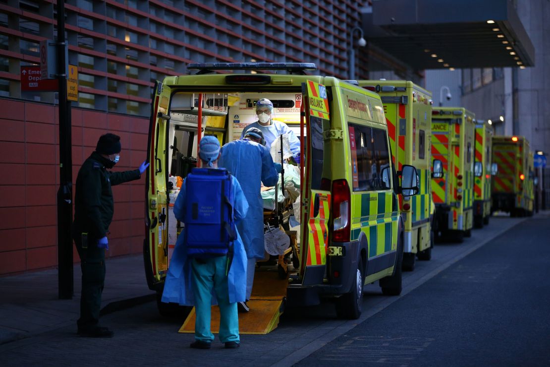 A patient is transported out of an ambulance by medics at the Royal London Hospital on January 2, 2021 in London, England.