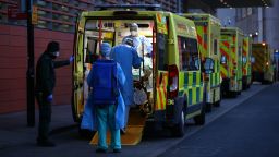 LONDON, ENGLAND - JANUARY 02: A patient is transported out of an ambulance by medics at the Royal London Hospital on January 2, 2021 in London, England. As of December 28th, NHS statistics showed there were 23,823 people in hospital with covid-19, higher than the spring peak of 21,683 recorded on 12 April. Today, the UK reported a further 57,725 people have tested positive for covid-19, a new daily high. (Photo by Hollie Adams/Getty Images)