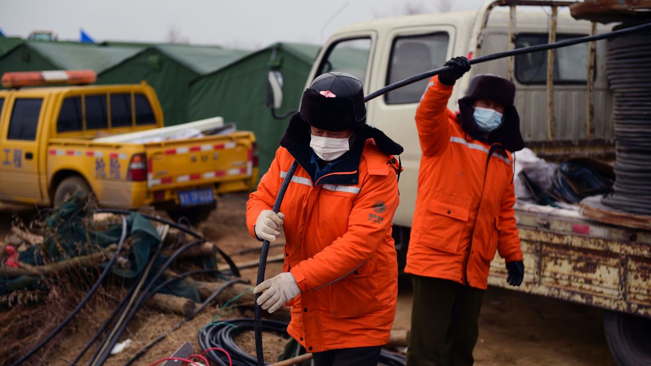 Members of a rescue team work at the site of a gold mine explosion where 22 miners are trapped underground in Qixia, in eastern China's Shandong province, on January 20, 2021.