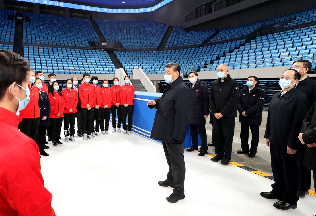 Chinese President Xi Jinping talks with athletes and coaches of China's national figure skating and short track speed skating teams while visiting the Capital Gymnasium in Haidian District, Beijing, on January 18.