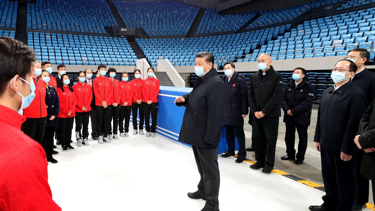 Chinese President Xi Jinping talks with athletes and coaches of China's national figure skating and short track speed skating teams while visiting the Capital Gymnasium in Haidian District, Beijing, on January 18.