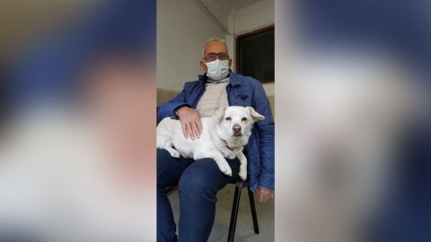 Boncuk, pictured here with owner Cemal Senturk, waited outside the hospital for six days.