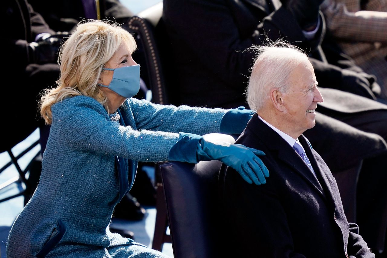 Jill Biden embraces her husband after his inaugural address.