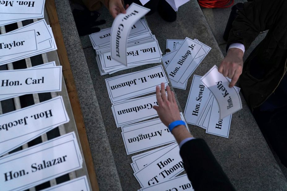 Name tags for seating assignments are organized before the inauguration.