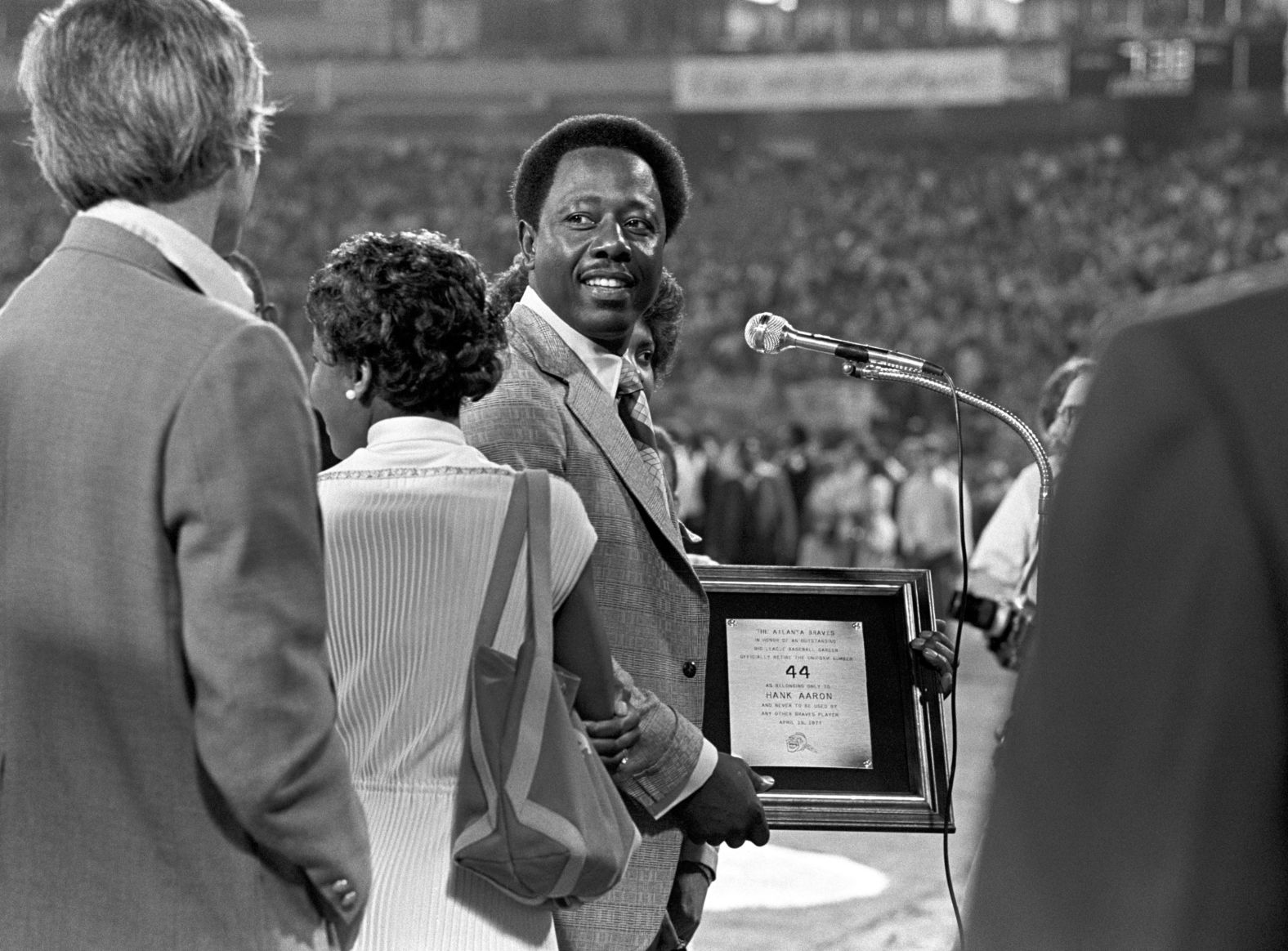 Aaron speaks as his number 44 was retired by the Braves in 1977. Aaron retired in 1976.