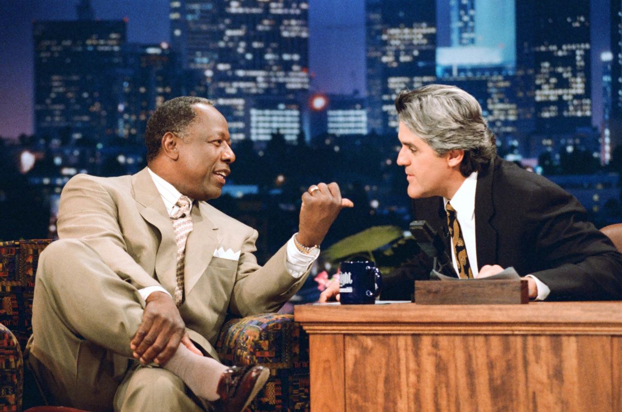 Aaron is interviewed by Jay Leno on a "Tonight Show" episode in 1995.