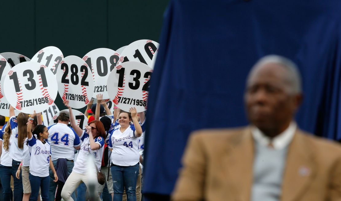 Fans hold up signs in the outfield with every home run hit by Aaron as he is honored on the 40th anniversary of his 715th on April 8, 2014, at Turner Field in Atlanta, Georgia. 