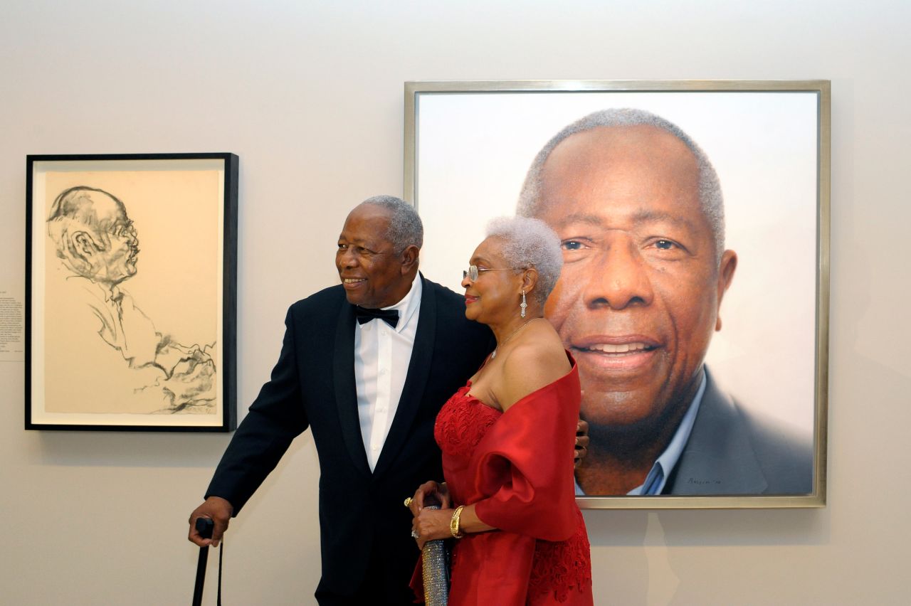 Aaron and his wife, Billye, pose in front of his portrait at the National Portrait Gallery in Washington, DC, in 2015.