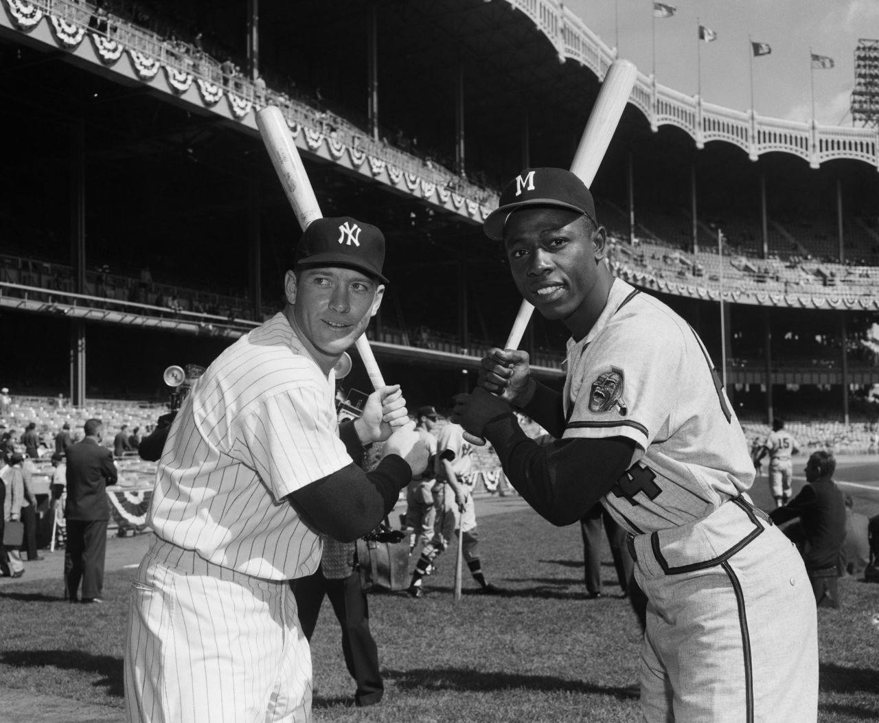Aaron poses with New York Yankees slugger Mickey Mantle in 1957. That season, Aaron was named the National League's Most Valuable Player and his team defeated the Yankees to win the World Series. 