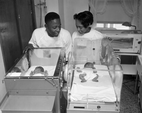Aaron and his first wife, Barbara, look at their newborn twins Lary, left, and Gary in 1957. Gary died in the hospital.